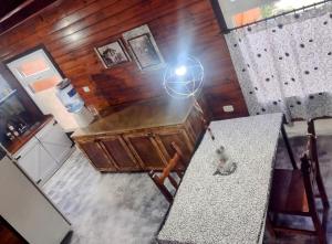 an overhead view of a kitchen with a counter and a table at Lo de Adriana in Tandil