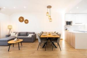 a living room with a table and a couch at Casa juley in Torrevieja