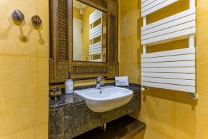 a bathroom with a sink and a mirror at Convivium 5 - High-end Studio in Gemmayze in Beirut +21 photos