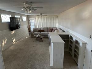 a living room with a couch and a table at Pigeon's Roost on Rushmore in Rapid City