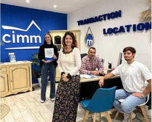 a group of people standing in an office at Desbo in Valras-Plage