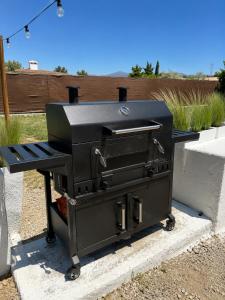 a barbecue grill sitting on top of a table at La Finquilla Holidays in Estepona