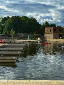a group of boats in a body of water at N8 Rooms by BW Living in Leipzig