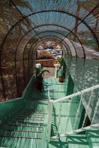 an arcade with stairs and plants on a building at Mikasa Ibiza Boutique Hotel ADULTS ONLY in Ibiza Town
