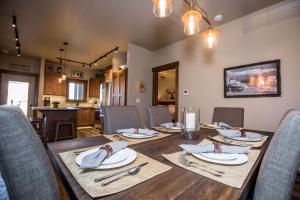 a dining room with a wooden table and chairs at Baker Loft 203 in Whitefish