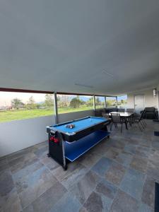 a pool table in the middle of a room at Sea view Kastri in Nei Poroi
