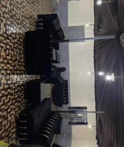 a room with black drapes and a stage at Kings Hotel and Lounge in Bwari