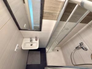 a bathroom with a sink and a mirror at Kamus in Baden-Baden +63 photos