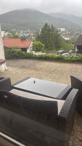 a pool table on a patio with a view at Ferienunterkunft International A in Bad Harzburg