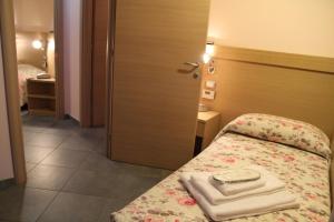 Posteľ alebo postele v izbe v ubytovaní Albergo Verdi