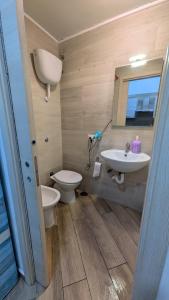 a bathroom with a toilet and a sink at Mare oltre in Castellammare di Stabia