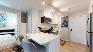 a kitchen with a white counter top in a room at Elkhorn Village Studio 2026 in Sun Valley +12 photos