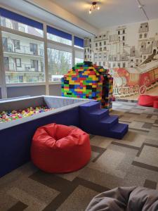 a childrens play room with a bed and a stack of legos at Kolejarz Natura Tour in Zakopane