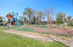 a park with a playground with a slide at Balansea Resort in Caesarea