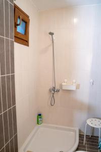 a bathroom with a bath tub and a toilet at Halkidiki Kassandra villa 3P Exclusive Peace & Beautiful Sea Views in Agia Paraskevi +72 photos
