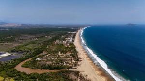 an aerial view of a beach and the ocean at Casa Tania playa larga in Agua de Correa