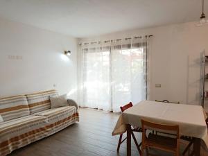 a living room with a couch and a table at Casa IS JANAS in San Sperate