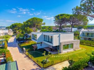 an aerial view of a white house at Azure Garden Villa 317 in Lalzit Bay