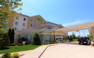 a hotel with a truck parked in front of it at Holiday Inn Effingham by IHG in Effingham