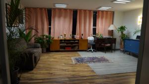an office with a desk and a chair and a table at Hostal del angel in Mexico City