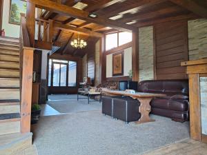 a living room with a couch and a table at Guest House Ivan in Bansko