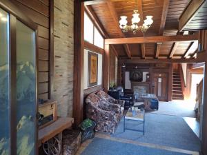 a living room with a couch and a chandelier at Guest House Ivan in Bansko
