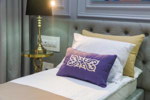 מיטה או מיטות בחדר ב-QonaQ hotel