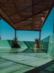 a tennis court with two potted plants on it at Mikasa Ibiza Boutique Hotel ADULTS ONLY in Ibiza Town +72 photos