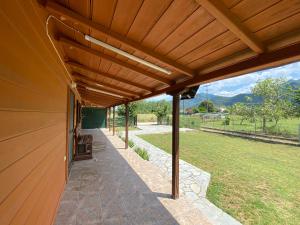 a wooden pergola on the side of a house at Garden Villa in Stavros
