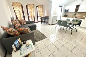 a living room with a couch and a table at Nido in Dervio - Premium Apartment in Dervio