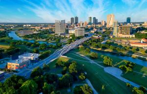 an aerial view of a city with a bridge over a river at Kimpton - Harper Hotel by IHG in Fort Worth