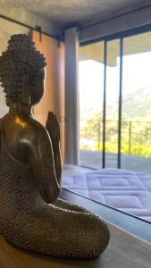 a statue of a woman sitting in a room at Boutique Loft – Spectacular View – Lake – Mountain in Valle de Bravo