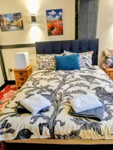 a bed with two pillows on it in a bedroom at Cornerstone Budget in Ashford