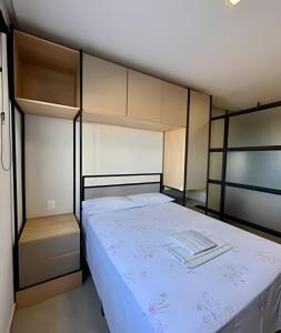 a bedroom with a large bed with white sheets at Studio Moderno Westfit - Barreto in Mossoró +19 photos