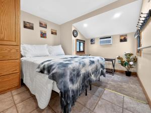 a bedroom with a large bed in a room at Key Largo Tiny House, Marina, Beach, and Pool Access in Key Largo +23 photos