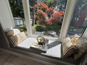 a window seat with a view of a yard at Amazing Garden view unit in Toronto