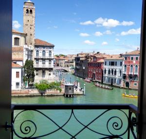 a view from a window of a river with boats at B&b Vista sul Canal Grande in Venice