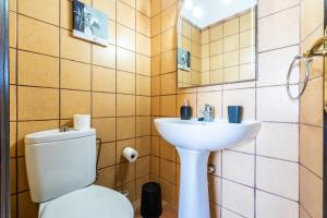 a bathroom with a toilet and a sink at Casa Susa in Adeje +9 photos