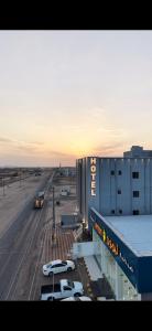 a view of an airport with cars parked in a parking lot at فندق نوفا ستاي in Nughaylah