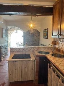 a kitchen with two sinks and a counter top at Marea Chianalea in Scilla