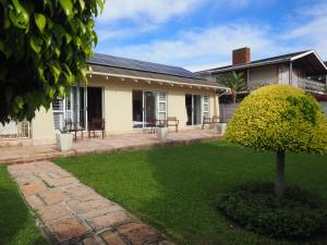 a house with a lawn in front of it at Keiskama B & B in Port Elizabeth