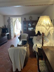 a living room with a bed and a table and chairs at Marea Chianalea in Scilla +16 photos