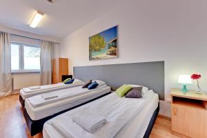 Posteľ alebo postele v izbe v ubytovaní Nice Rooms - Pokoje Gościnne