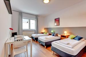 Posteľ alebo postele v izbe v ubytovaní Nice Rooms - Pokoje Gościnne