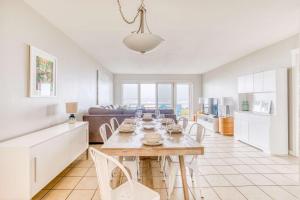 a kitchen and living room with a table and chairs at Pacific Sands Unit #10 in Neskowin