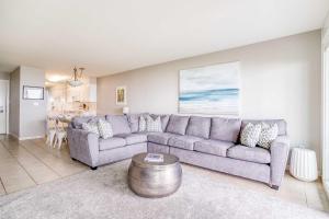 a living room with a couch and a table at Pacific Sands Unit #10 in Neskowin +10 photos