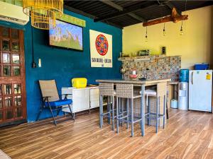 a kitchen with a counter and a island in a room at Suite Quelepa San Miguel in Quelepa +10 photos