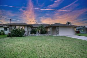 a house with a lawn in front of it at Moonlight Bay in Port Richey
