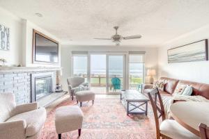 a living room with a couch and a fireplace at Waveside Hideaway, Unit 11 in Neskowin