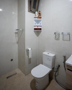 a bathroom with a toilet and a sink at Sahoria Stay in Dakhla +25 photos